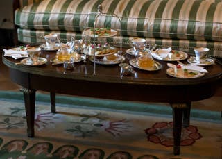 US President Donald Trump and First Lady Melania Trump with England's King George III. A table was set to host Charles and Queen Camilla of England for tea.